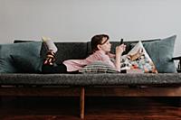 Girl playing with smartphone on couch
