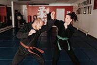 Couple practising martial arts in studio