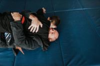 Coach and student wrestling in studio