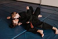 Coach and student wrestling in studio