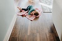 Female toddler asleep on security blanket in hallw