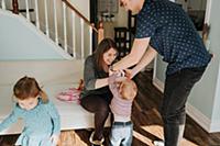 Mid adult couple with baby boy and female toddler 
