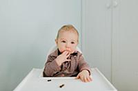 Baby boy in high chair, portrait