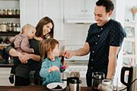 Mid adult couple with toddler daughter and baby so