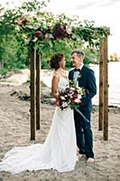 Romantic bride and groom looking at each other on 