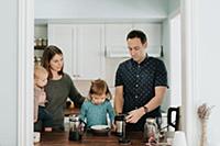Mid adult couple with toddler daughter and baby so