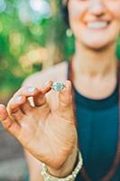 'Woman holding ring with words ''Love the Life you