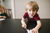 Boy playing at table