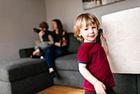 Mother and sons in living room