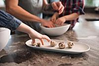 Children enjoying freshly baked vegetarian seed ba