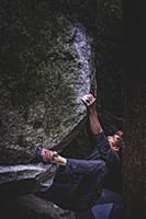 Climber bouldering in forest, Squamish, Canada