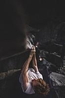 Climber bouldering in forest, Squamish, Canada