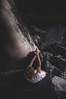 Climber bouldering in forest, Squamish, Canada