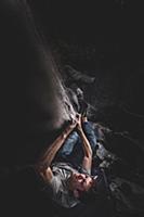 Climber bouldering in forest, Squamish, Canada