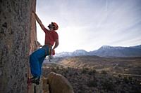 Climber trad climbing, Little Egypt, Bishop, Calif