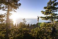 Man on peak at sunrise, Lake Tahoe, Tahoe City, Ca