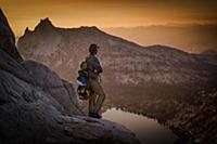 Climber enjoying view on peak, Tuolumne Meadows, Y
