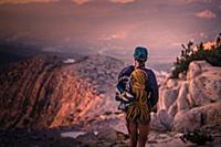 Climber enjoying view on peak, Tuolumne Meadows, Y