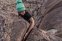 Climber with hand in offwidth crack, Sierra Nevada