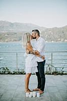 Romantic mid adult couple kissing on lakeside, Str
