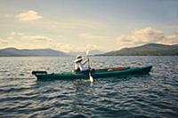 Woman paddling kayak, Adirondacks, Lake George, Ne