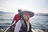 Smiling woman and friend in canoe