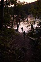 Family enjoying lake at sunset