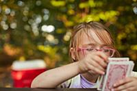 Girl playing cards