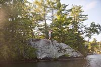 Father and daughter cliff jumping