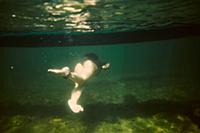 Girl swimming underwater