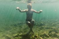 Girl swimming underwater