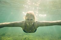 Woman swimming underwater