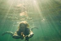 Woman swimming underwater