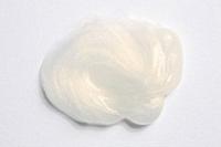 Blob of white shiny hair styling product on white 