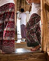 Two women wearing pyjama hose and standing