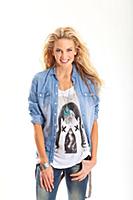 Portrait of pretty blonde woman wearing denim shir