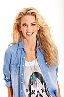 Portrait of pretty blonde woman wearing denim shir