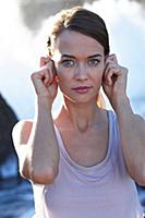 Portrait of brunette woman performing sukshma yoga