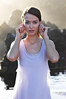 Portrait of brunette woman performing sukshma yoga