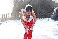 Side view of brunette woman performing sukshma yog