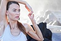 Portrait of brunette woman performing sukshma yoga