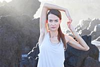 Portrait of brunette woman performing sukshma yoga