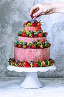 Red cake with watermelon, strawberries, raspberrie