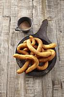 A churro, a fried dough sweet pastry based snack