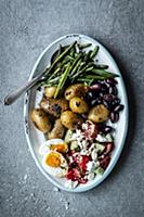 Antipasti platter with beans, potatoes, olives, eg