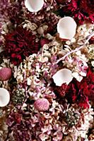 An arrangement of pink shades made from flowers, l