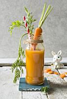 Fresh carrot juice smmothy drink in a jar with bun