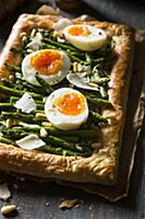 Vegetaraian asparagus tart with boiled eggs, parme