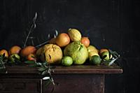 Various citrus fruits on a wooden table