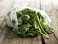 Fresh spinach leaves in a plastic bag